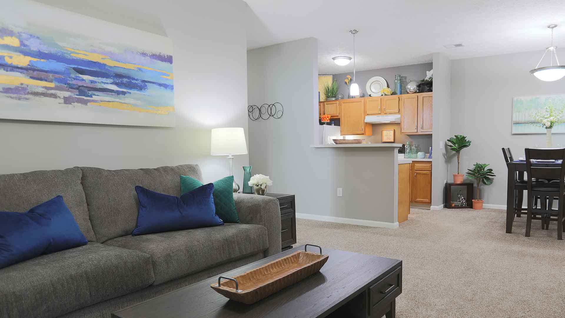 Open living room with a connected kitchen.