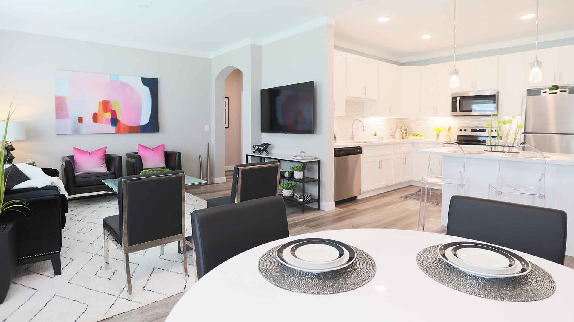 Open and vibrant living room space and kitchen at Greyson on 27 apartments.