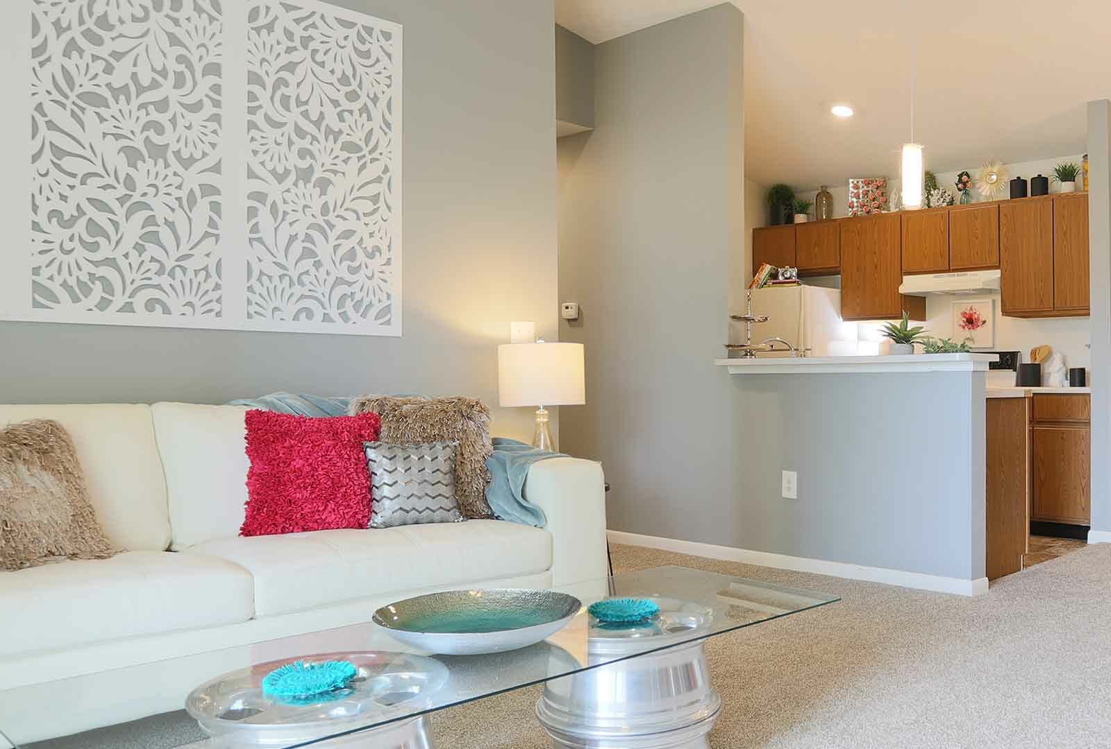 Decorated living room area connected to kitchen at Island Club.