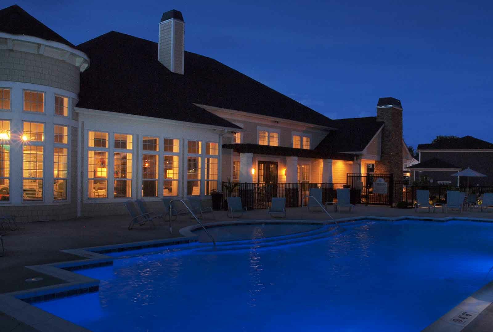 Pool with night lighting and lounge deck at Kendal on Taylorsville.