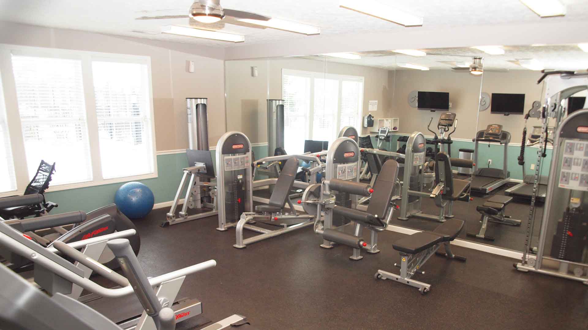 Fitness center with exercise machines at Landings at Beckett Ridge.