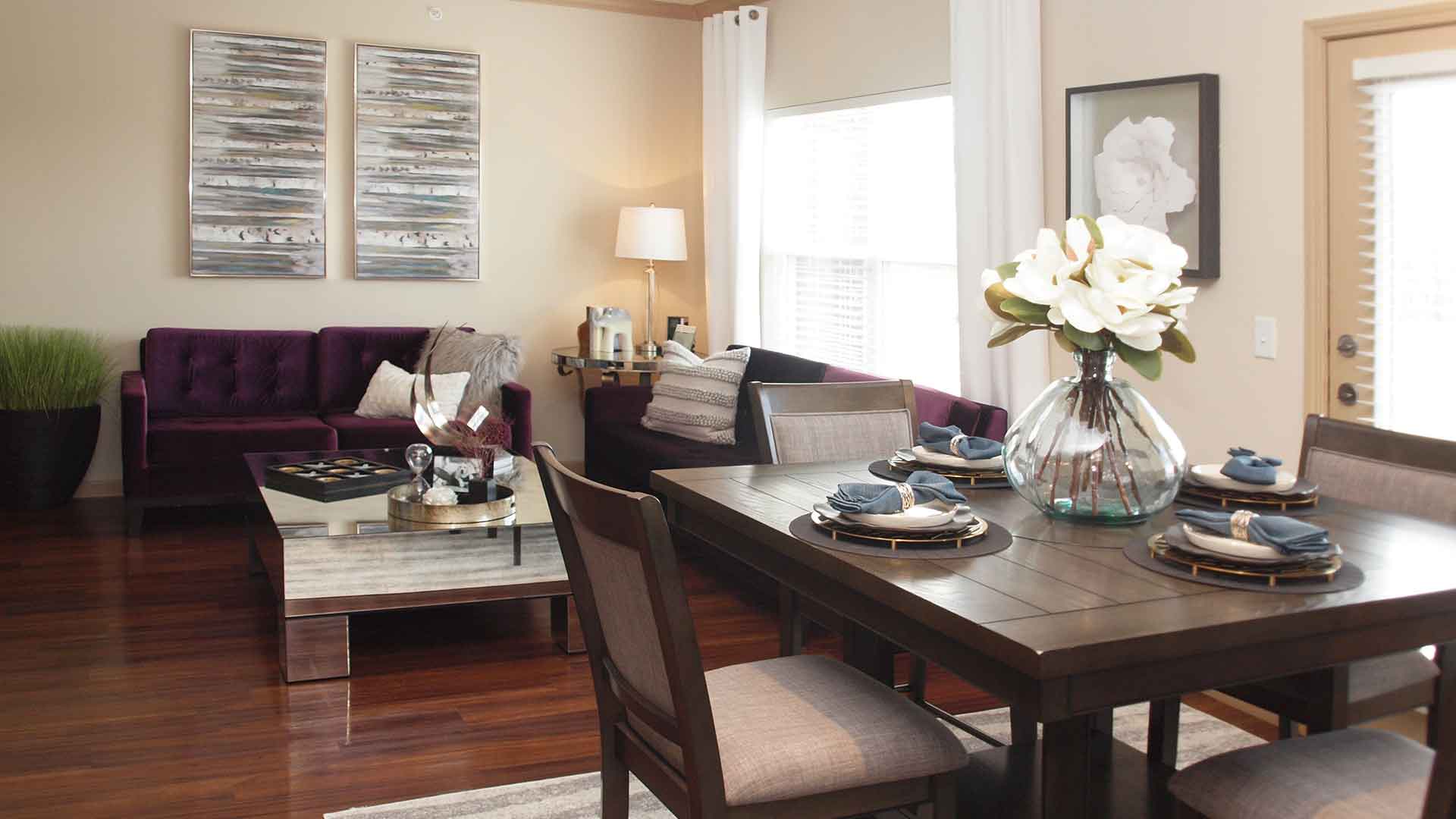 Fully decorated living and dining room space at Palmera.