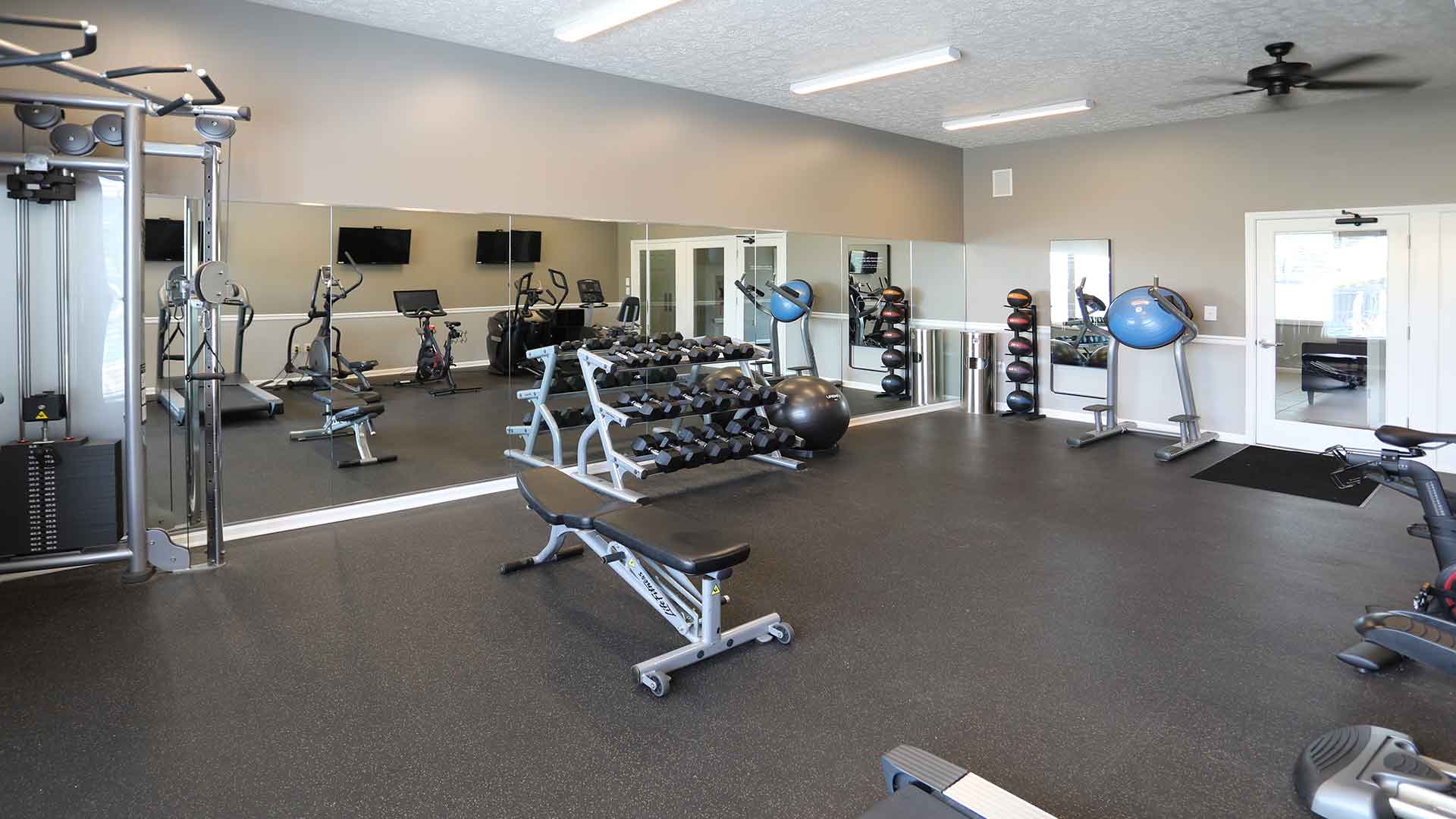 Fully equipped fitness center with free weights at Shadow Ridge.