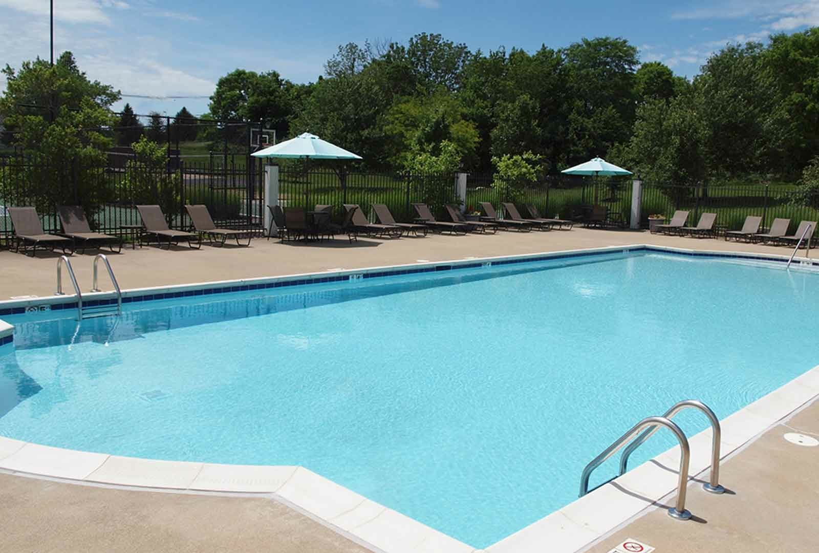 Outdoor pool with lounge deck at Shadow Ridge.