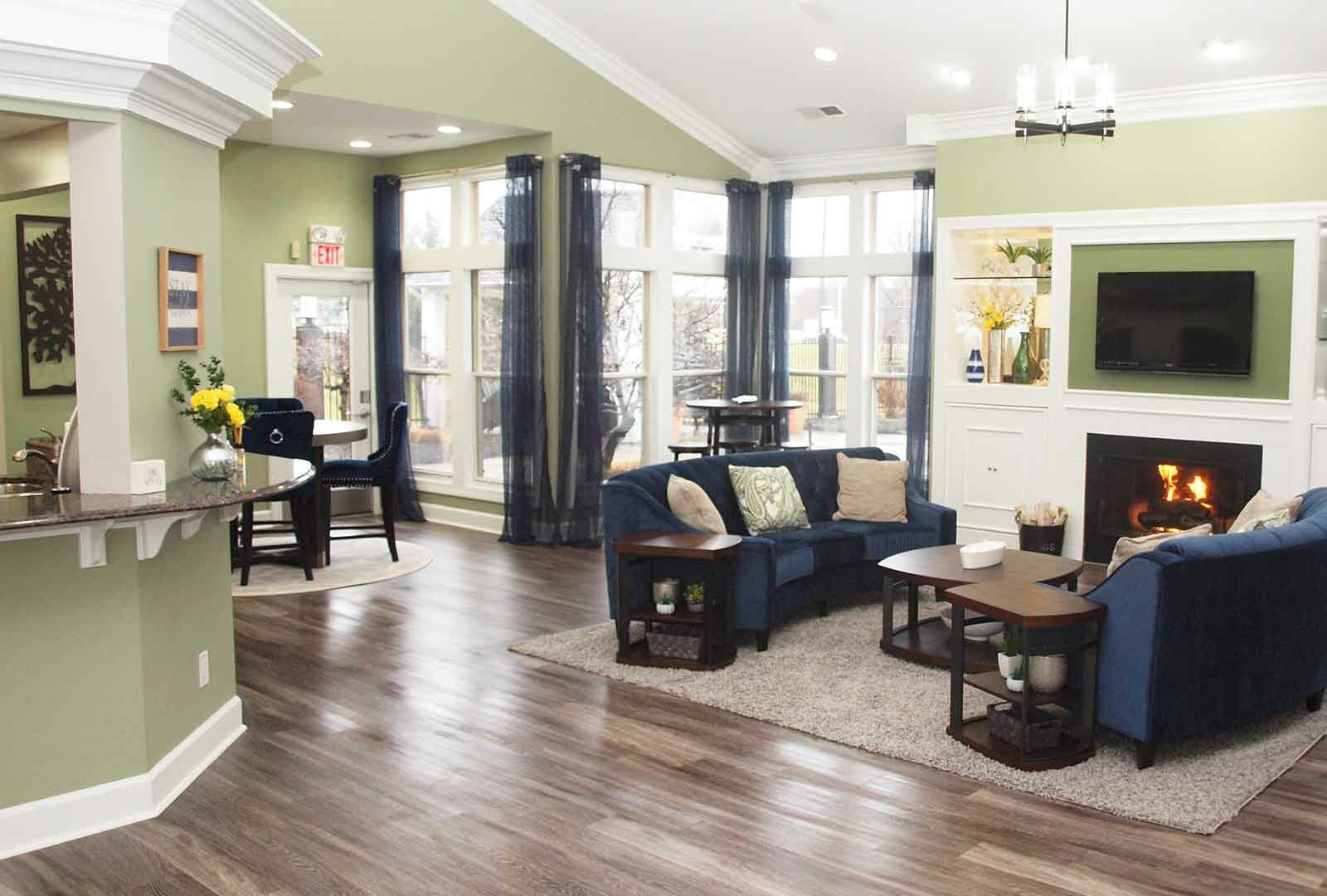 Decorated clubhouse lounge area with fireplace at Waterford Place.