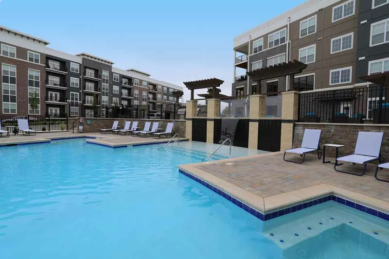 Outdoor community pool with lounge deck at Allure.