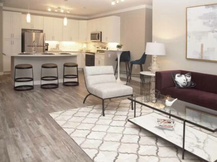 Furnished apartment living space with hardwood floors at Element Oakwood.
