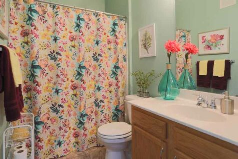 Decorated bathroom with ample counter space at Emerald Lakes.