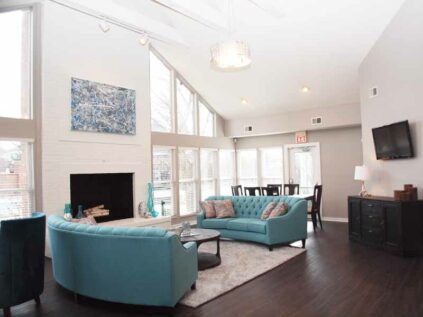 Decorated clubhouse lounge with fireplace at Fox Chase North.