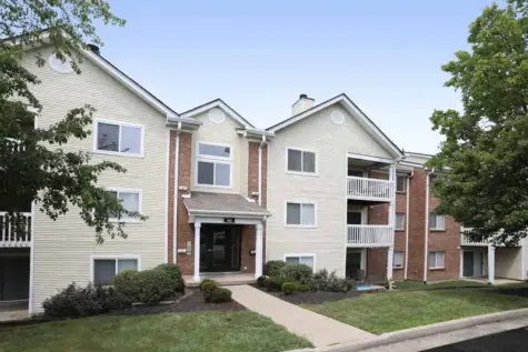 Apartment building exterior with balconies and landscaping at Fox Chase South.