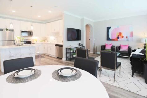 Decorated kitchen, living, and dining room at Greyson on 27.