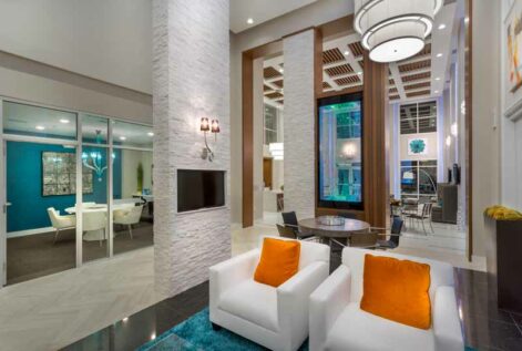 Modern resident area with TVs and seating areas.