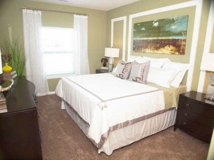 Spacious bedroom with natural lighting at Kendal on Taylorsville.