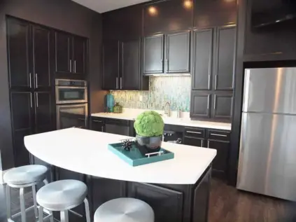 Spacious kitchen with appliances in clubhouse lounge at Kendal on Taylorsville.