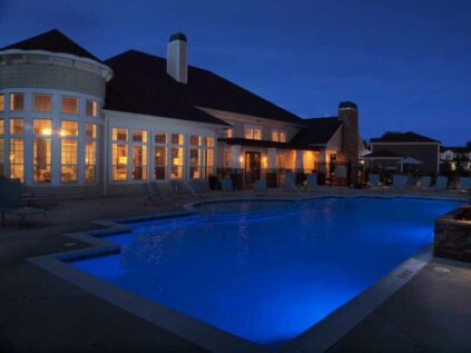 Pool with night lighting and lounge deck at Kendal on Taylorsville.