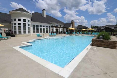 Outdoor pool with spacious lounge deck at Kendal on Taylorsville.