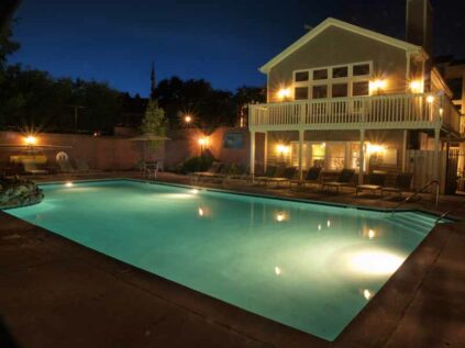 Outdoor pool with night lighting at Mallard Landing.
