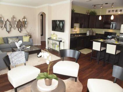 Large open living space connected to kitchen.