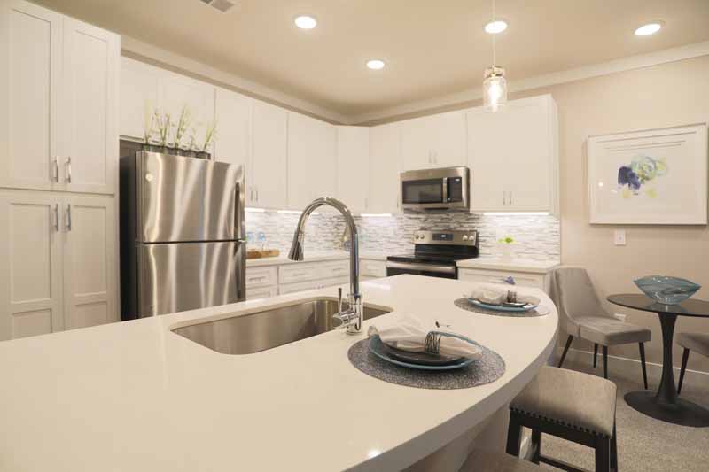 Spacious modern kitchen with stainless steel appliances at Rialto on Hurstbourne.