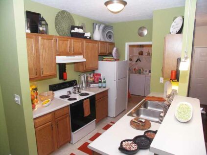Decorated kitchen and attached laundry space at Reserve at Miller Farm.