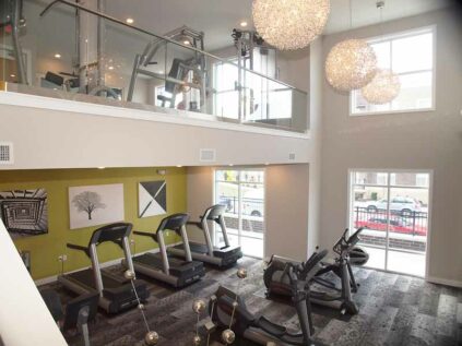 Two-level fitness center with workout machines at Savoy of West Chester.