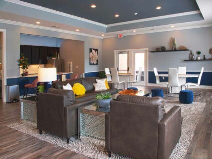 Wide open clubhouse with beautiful decor and furniture.