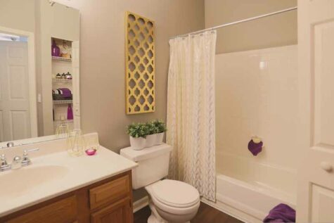 Bathroom with combination tub and shower at Wellington Place.