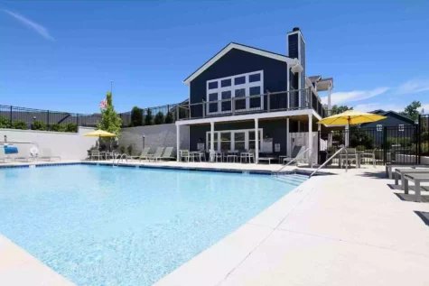 Community pool at Mallard Landing Apartments next to clubhouse.