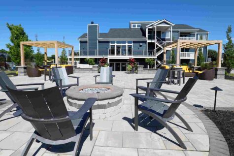 Clubhouse patio with gas fire pit and cabanas.