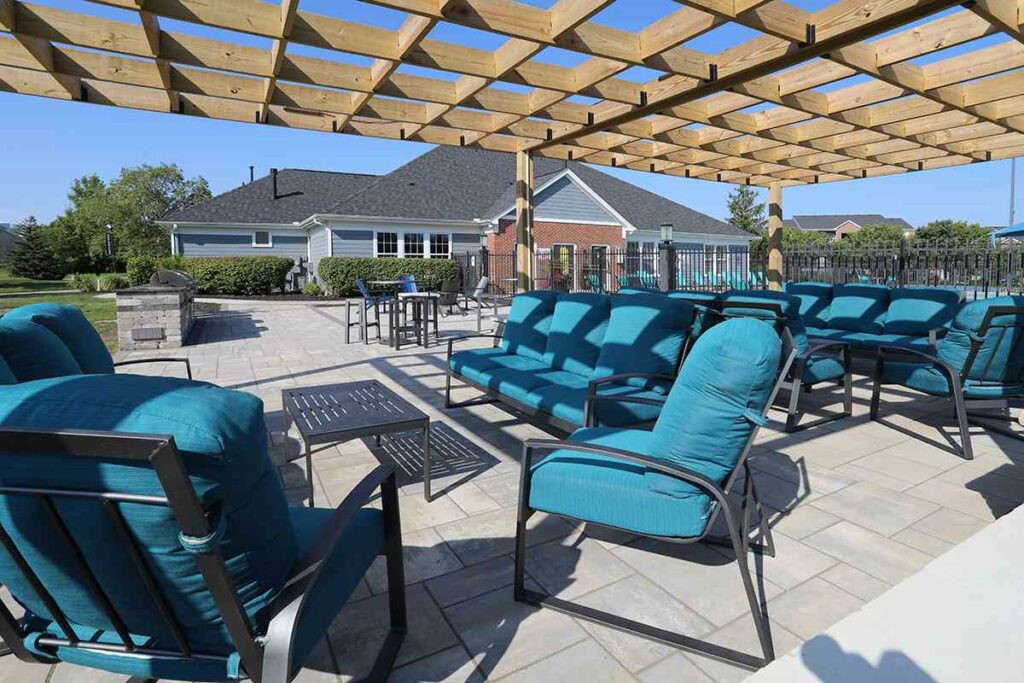 A large outdoor social deck filled with patio furniture.