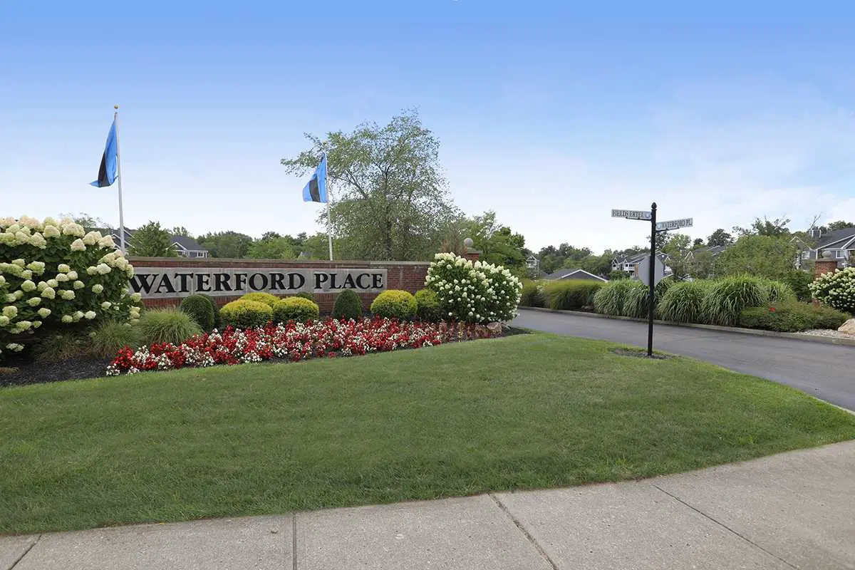 A large brick sign displaying the words,