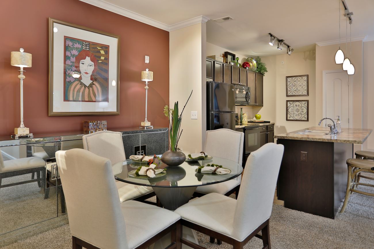 A Brinley Place apartment home's kitchen and dining area, featuring modern amenities.