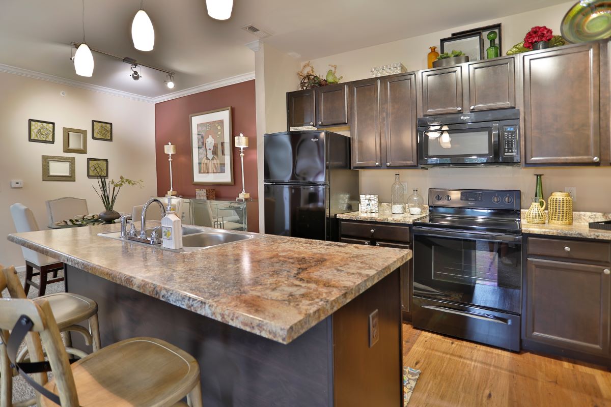 A view of a Brinley Place apartment home kitchen and its amenities.