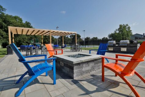 Fox Chase North's Social Deck, featuring social seating arrangements and a fire pit.