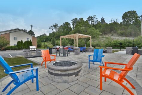 An outdoor gathering space at Fox Chase South, complete with fire pit.