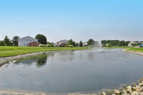 A view of the Reserve at Miller Farm's apartment homes and main water feature.