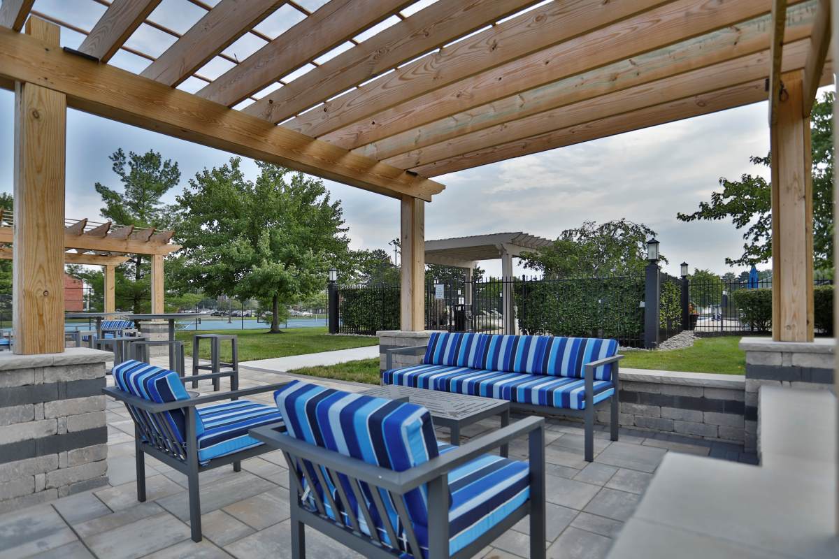 Outdoor seating area at The Reserve at Miller Farm's pool area.
