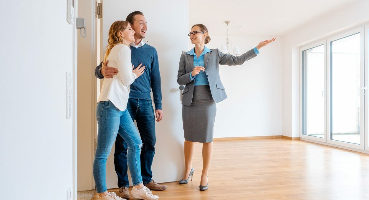 Property manager gives an apartment tour to a couple