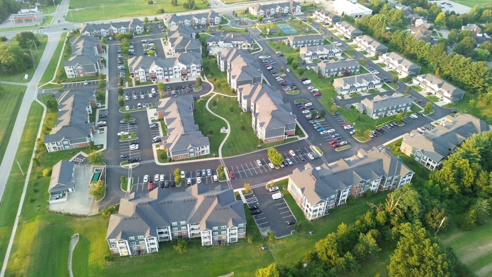 Aerial Photo of an Apartment Complex in a Green Field