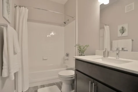 Bathroom at Emerald Lakes Apartments with full shower and bathtub