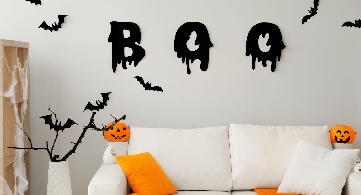 An apartment living room decorated for Halloween.