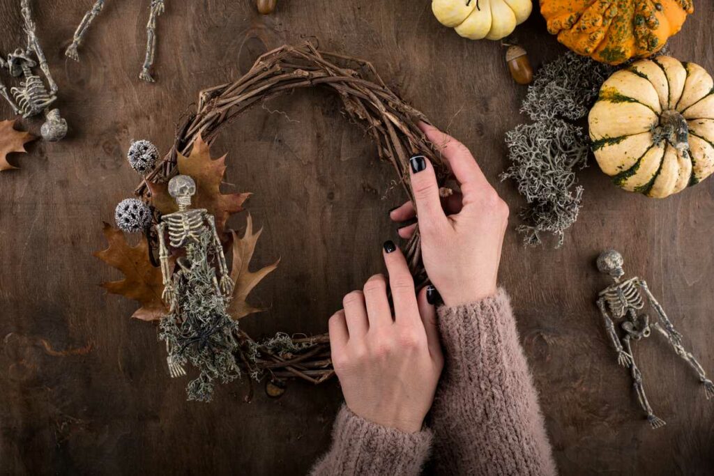 A happy mother and daughter organize fall leaves for DIY crafts.