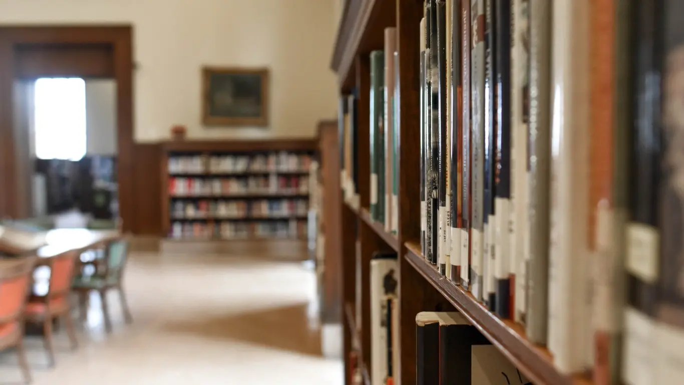 Library image with shelves of books and tables