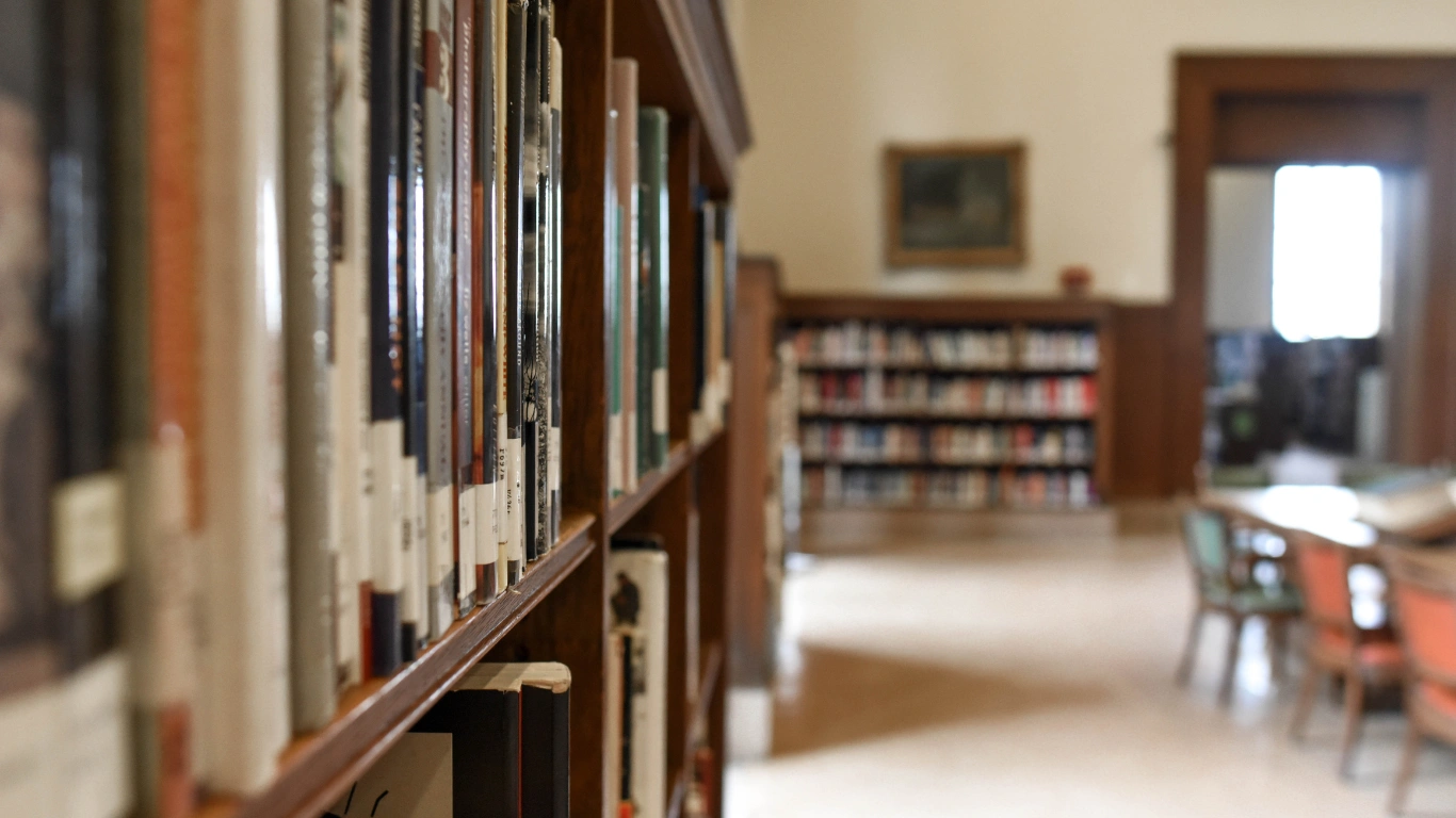 Library image with shelves of books and tables