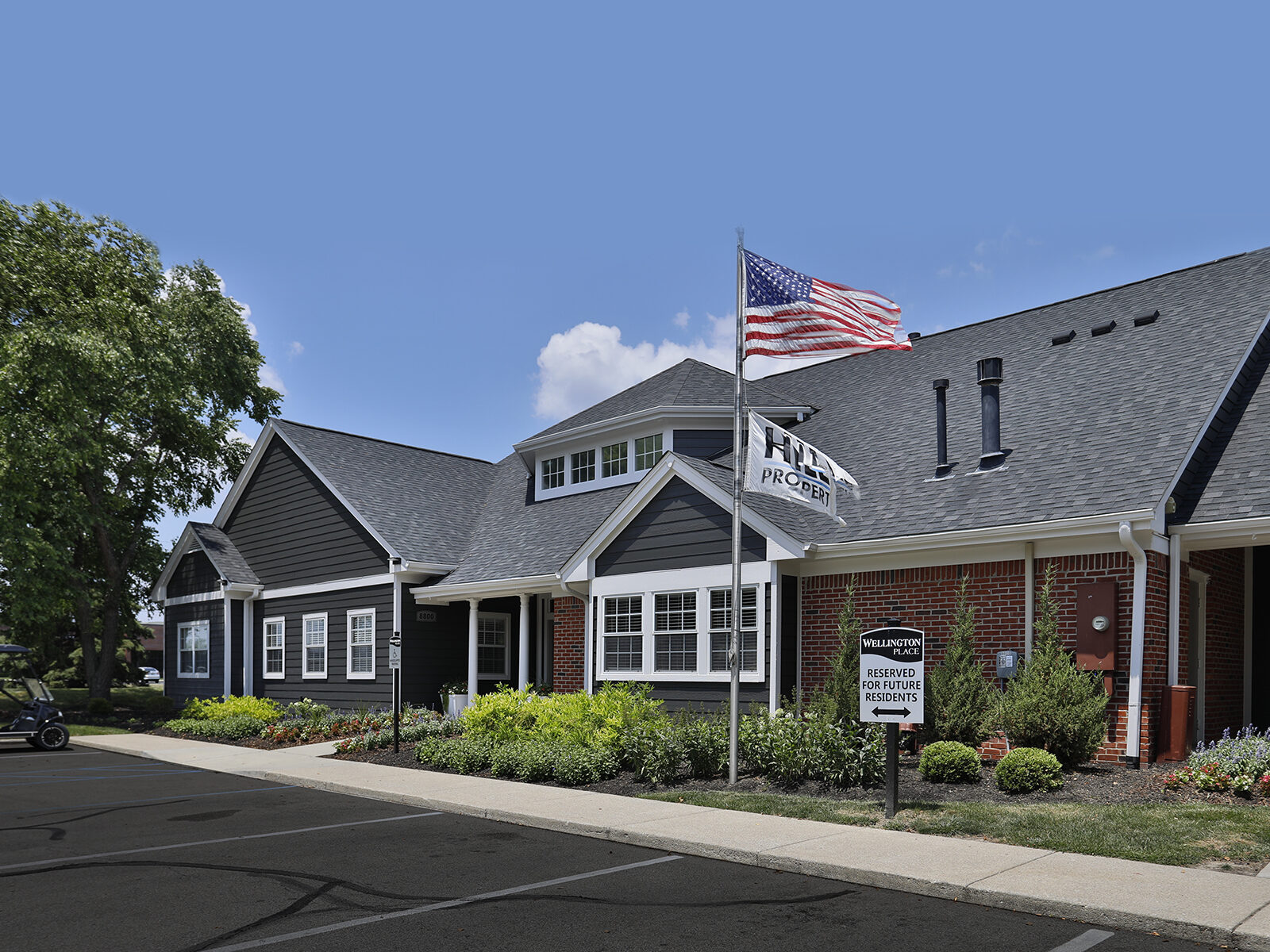 Clubhouse at Wellington Place Apartments featuring modern furnishings, a kitchenette, and stylish finishes, ideal for social gatherings and resident events.
