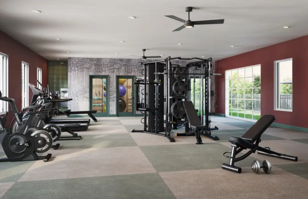 Relay 129 fitness center with individual workout pods and outdoor turf.