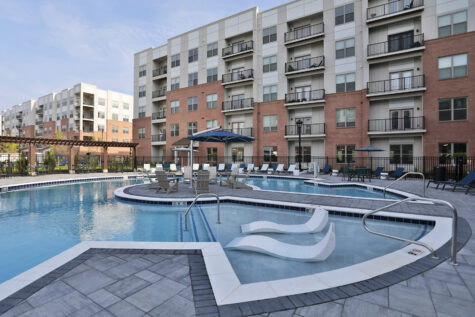 Clocktower West Chester sparkling swimming pool with seating.