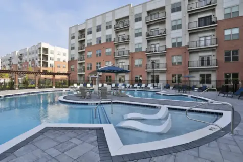 Clocktower West Chester sparkling swimming pool with seating.
