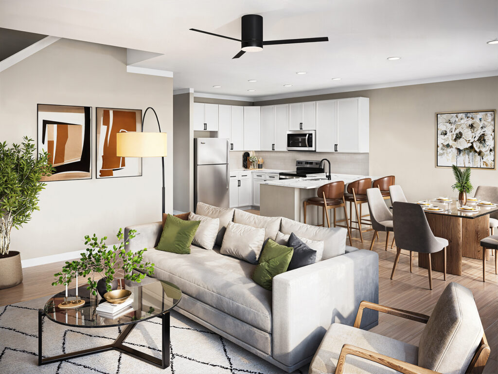 Open-concept living space at Relay 129 in Liberty Township featuring quartz countertops, stainless steel appliances, and two-tone cabinetry.