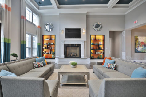 Clubhouse and leasing office at Kendal on Taylorsville featuring inviting lounge seating and a modern coffee bar, creating a warm and welcoming space for residents and guests.
